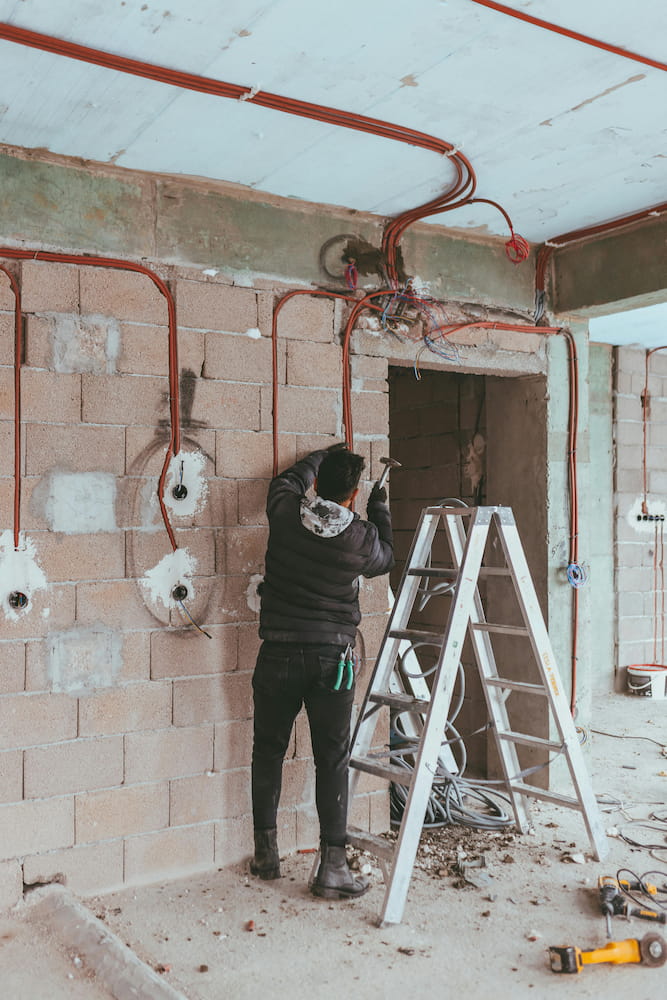 Professional electrician installing wiring